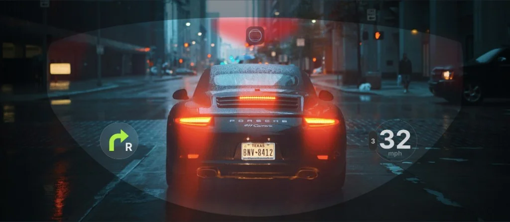 Street view through Gia visor — HUD elements in rider field of view